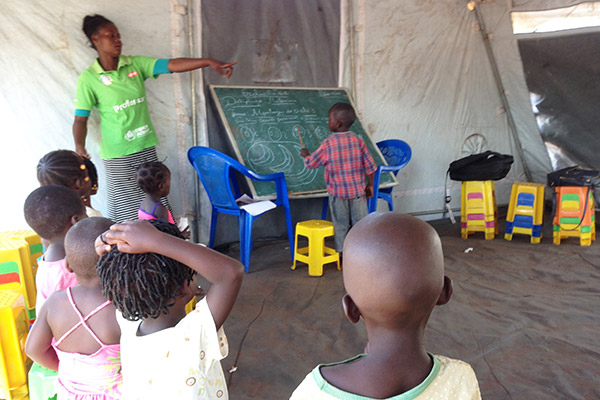Children in a classroom with teacher