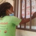 TCE Cuanza Norte School Health Agent put up Covid-19 posters at schools in preparation for the start of the school year